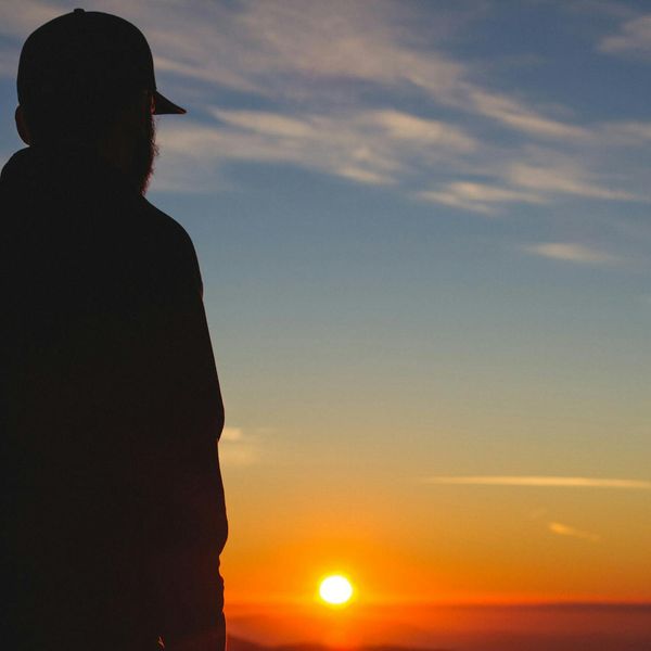 Silhouette of a man at sunrise, symbolizing energy and a new beginning.